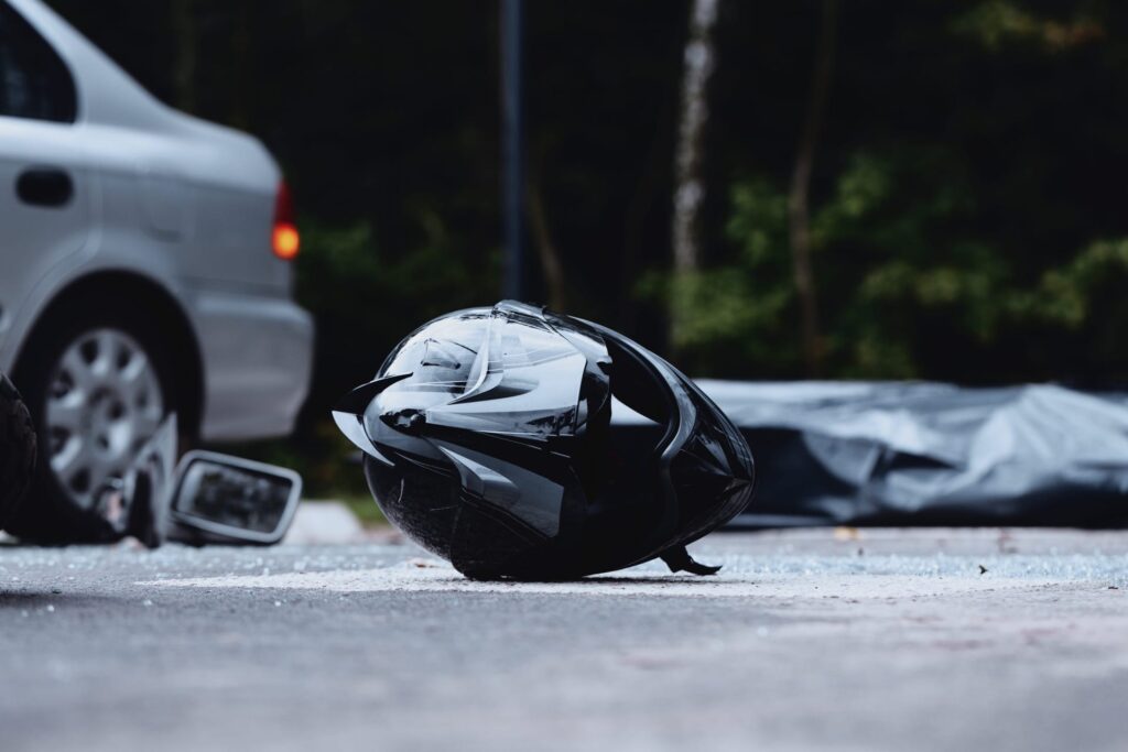 Photo of Helmet on the Ground after a Motorcycle Accident