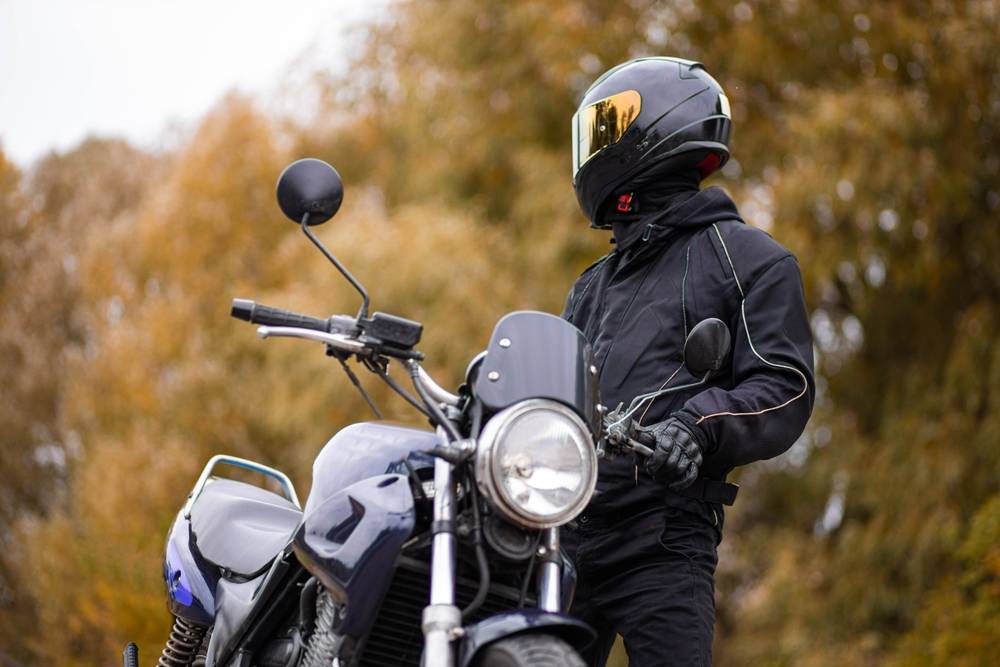 Photo of a man with the motorcycle