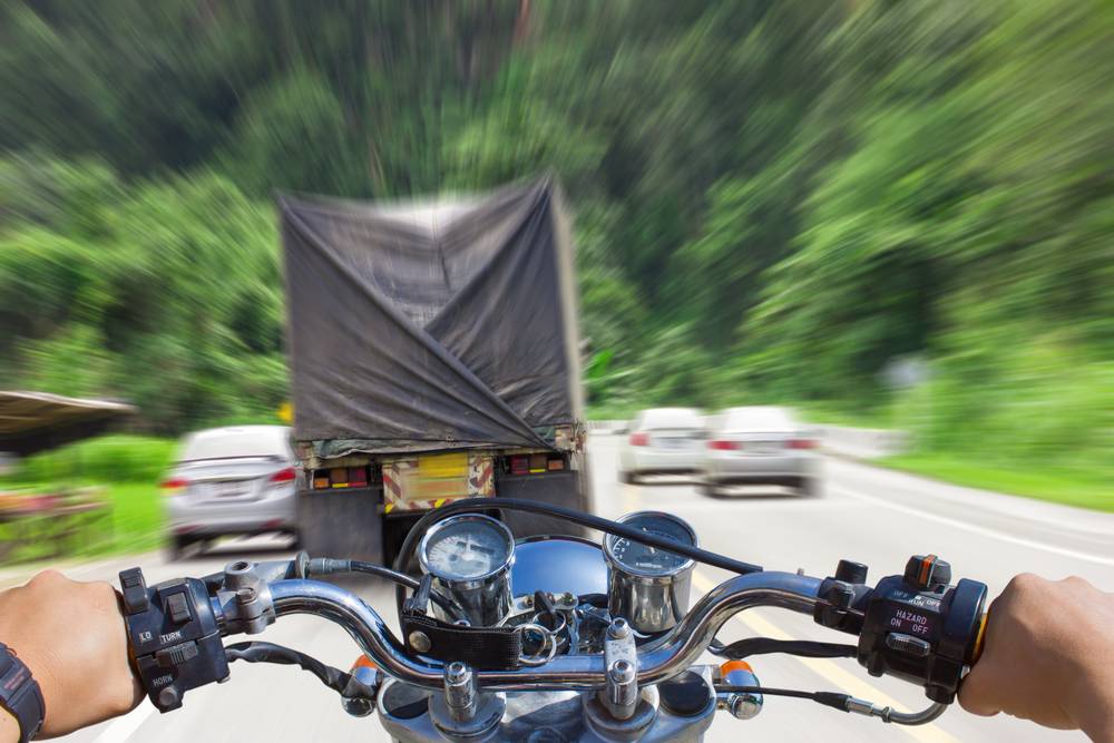 Photo of a man riding motorcycle