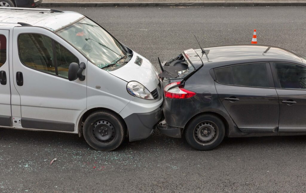 Auto accident involving two cars on a city street